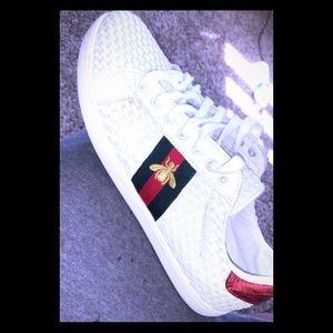 A pair of Gucci shoes thrown from a J.cole concert